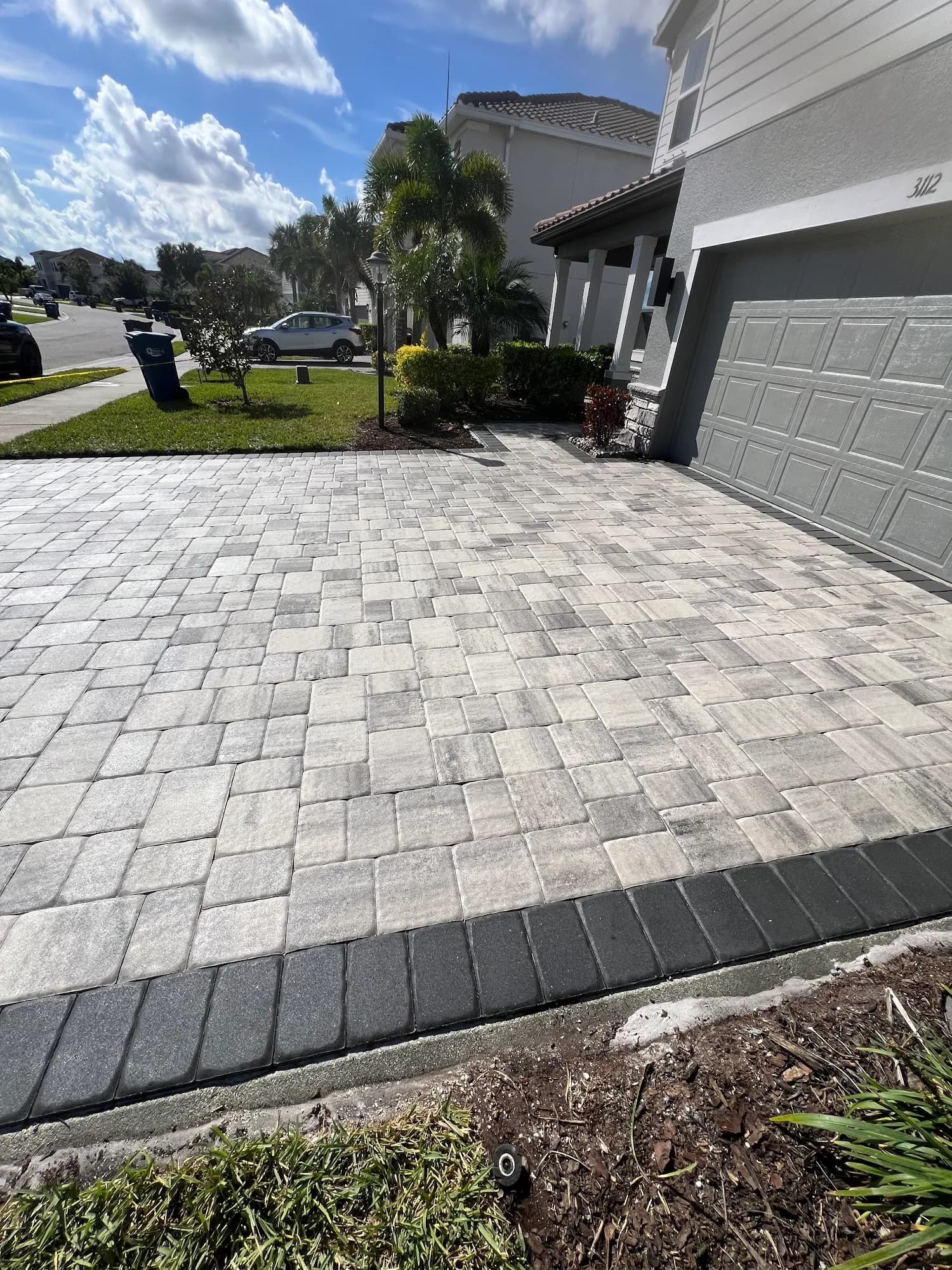 Paver driveway with a contrasting soldier-course border in Palmetto, FL