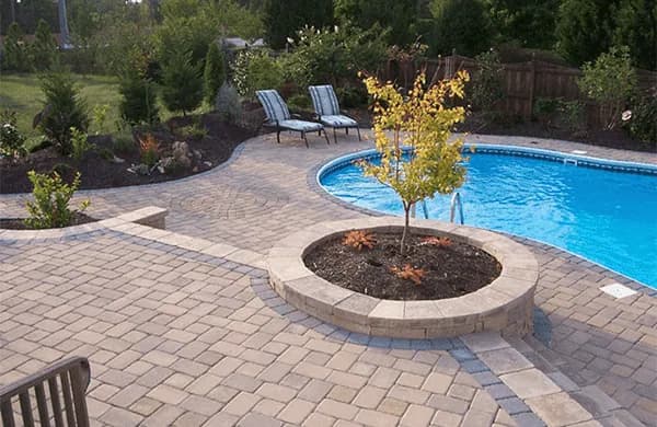 Paver pool deck surrounding a swimming pool in Sarasota FL