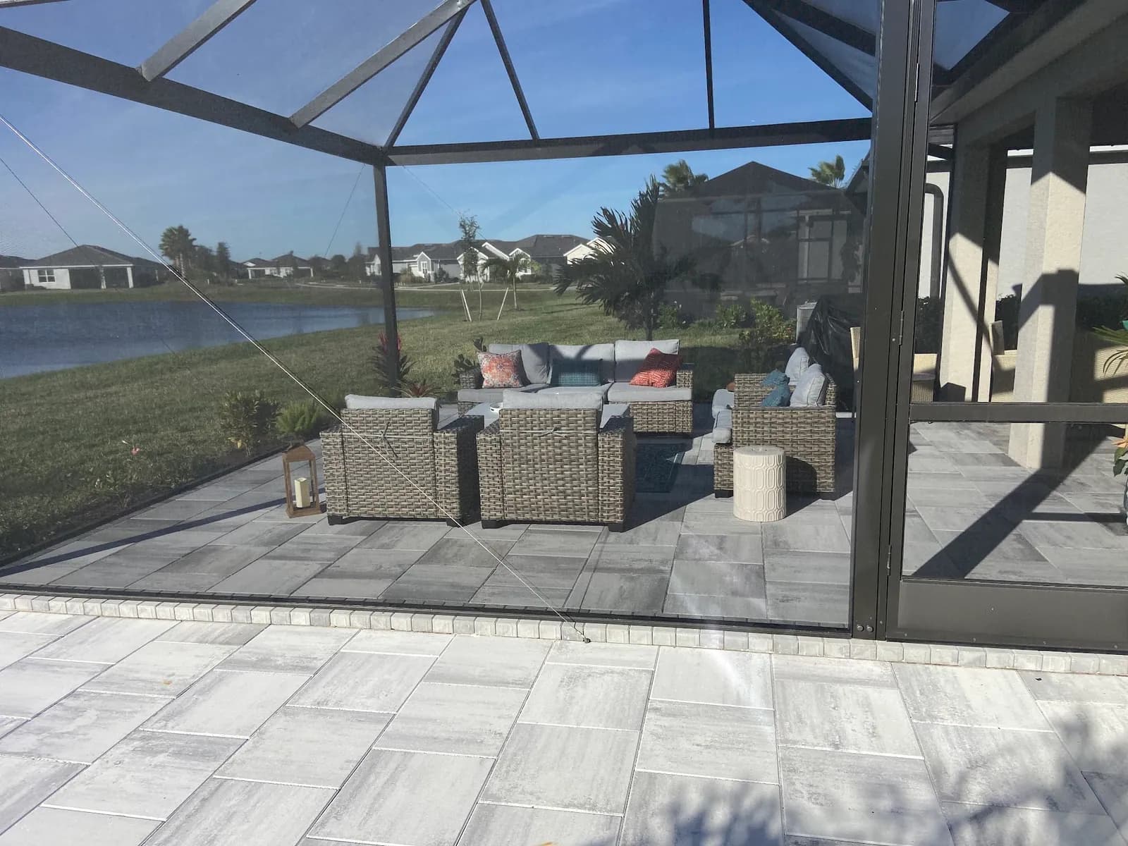 Screened pool-cage lanai with paver flooring in Sarasota FL